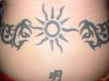tribal sun and cloud tattoo